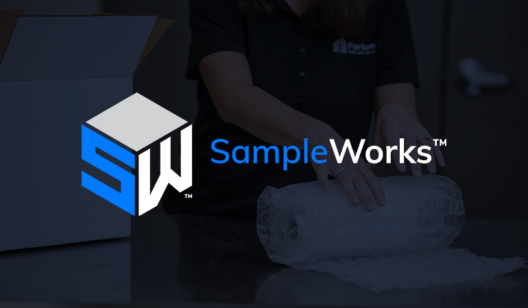 Forium Solutions employee-owners packaging a sample for SampleWorks program