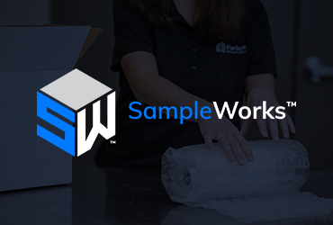 Employee-owners packaging a sample for SampleWorks in the Forium warehouse
